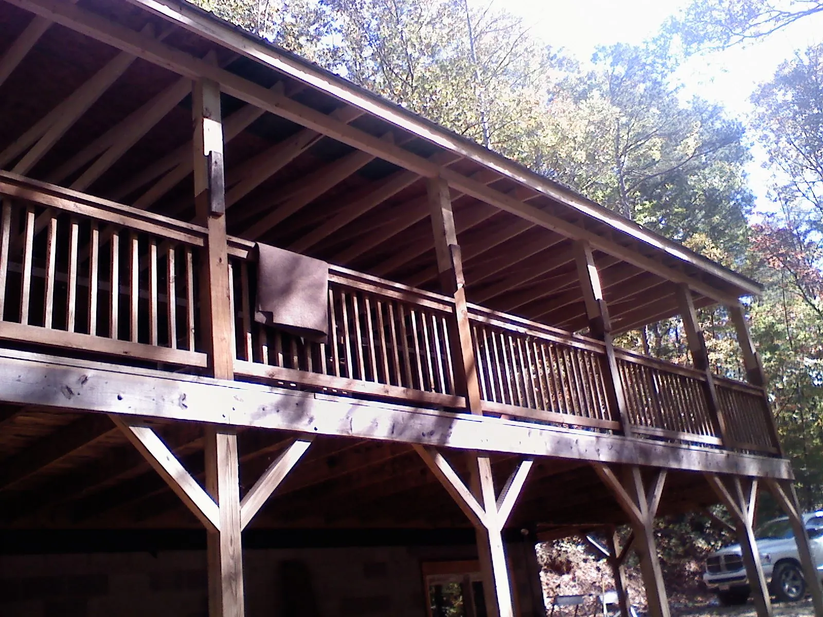 Timber framing under a new elevated porch and deck — Roof Leak Repair in Moore by Roofing Brothers